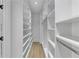 Walk-in closet features wood floors, rod hangers, and ample shelving units at 3562 Clubland Dr, Marietta, GA 30068
