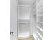 Organized walk-in closet with open shelving and rods for ample storage in neutral tones at 3562 Clubland Dr, Marietta, GA 30068