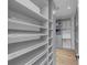 A walk-in closet features custom shelving, drawers, and ample storage space at 3562 Clubland Dr, Marietta, GA 30068