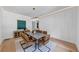 Bright dining room features panel molding, modern chandelier, and stylish contemporary decor at 3562 Clubland Dr, Marietta, GA 30068