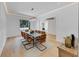 Bright dining room featuring a modern chandelier, stylish furniture, and natural light from a large window at 3562 Clubland Dr, Marietta, GA 30068