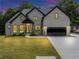 Charming two-story home featuring a well-manicured lawn, garage, and modern architecture at 3562 Clubland Dr, Marietta, GA 30068