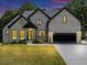 Charming two-story brick home with a well-manicured lawn and an attached garage at 3562 Clubland Dr, Marietta, GA 30068