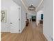 Light-filled hallway with hardwood floors, recessed lighting, and an open doorway to the living room at 3562 Clubland Dr, Marietta, GA 30068
