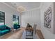 Stylish home office featuring paneled walls, hardwood floors, and a modern chandelier at 3562 Clubland Dr, Marietta, GA 30068