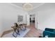 Bright home office with hardwood floors, a modern chandelier, and views into the hallway at 3562 Clubland Dr, Marietta, GA 30068