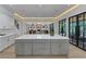 Bright kitchen showcasing a large island with seating, stainless steel appliances, and ample cabinet space at 3562 Clubland Dr, Marietta, GA 30068
