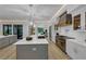 Bright kitchen featuring a large island, stainless steel appliances, and connection to the living area at 3562 Clubland Dr, Marietta, GA 30068