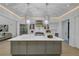 Open kitchen featuring an island, stainless steel appliances, stylish pendant lights, and modern finishes at 3562 Clubland Dr, Marietta, GA 30068