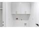 A well-lit laundry room features white cabinets and sleek design at 3562 Clubland Dr, Marietta, GA 30068