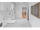 A bright laundry room features custom cabinets and easy access to the hallway at 3562 Clubland Dr, Marietta, GA 30068