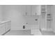 This laundry room offers custom cabinets, a sink, and a convenient layout at 3562 Clubland Dr, Marietta, GA 30068