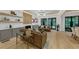 Spacious living room featuring hardwood floors, modern light fixtures, comfortable seating, and a decorative fireplace at 3562 Clubland Dr, Marietta, GA 30068