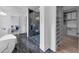 Bright main bath features a glass enclosed shower and access to a walk-in closet at 3562 Clubland Dr, Marietta, GA 30068