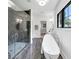 The main bathroom offers a stand-alone tub, glass enclosed shower, and marble tile at 3562 Clubland Dr, Marietta, GA 30068