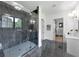 The main bath offers a glass enclosed shower with marble, and dual vanities at 3562 Clubland Dr, Marietta, GA 30068