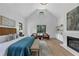 Spacious main bedroom with seating area, fireplace, and natural light at 3562 Clubland Dr, Marietta, GA 30068