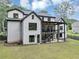 View of the home's rear exterior featuring a covered patio and upper deck area, perfect for outdoor living at 3562 Clubland Dr, Marietta, GA 30068