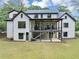 View of the home's rear exterior featuring a covered patio and upper deck area, perfect for outdoor living at 3562 Clubland Dr, Marietta, GA 30068