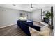 Comfortable living room with a stone fireplace, plush furniture, and wood-look flooring at 30 Court S, Ellenwood, GA 30294