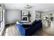 Spacious living room with a stone fireplace, neutral walls, and an adjacent dining area at 30 Court S, Ellenwood, GA 30294