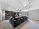 Spacious living room with a built-in entertainment center, plush seating, and a ceiling fan at 30 Court S, Ellenwood, GA 30294