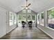 Light-filled sunroom featuring large windows, a vaulted ceiling, and contemporary decor at 30 Court S, Ellenwood, GA 30294