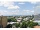 Sweeping city view from condos featuring green trees and sunny skies at 3324 Peachtree Ne Rd # 1604, Atlanta, GA 30326