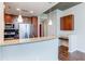 Modern kitchen with stainless steel appliances, granite countertops, and a breakfast bar with pendant lights at 3324 Peachtree Ne Rd # 1604, Atlanta, GA 30326
