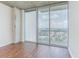 Cozy living room featuring wood floors, and large windows with city views and balcony access at 3324 Peachtree Ne Rd # 1604, Atlanta, GA 30326