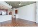 Open-concept living and kitchen area with wood floors, modern lighting, and stainless steel appliances at 3324 Peachtree Ne Rd # 1604, Atlanta, GA 30326