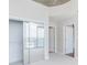 Bedroom featuring light colored carpet, closet with mirrored doors and access to the en-suite bathroom at 3324 Peachtree Ne Rd # 1604, Atlanta, GA 30326