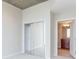 Bedroom featuring light colored carpet, closet with mirrored doors and access to the en-suite bathroom at 3324 Peachtree Ne Rd # 1604, Atlanta, GA 30326