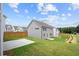Well-maintained backyard showcasing a patio area and newly planted landscaping, offering a serene escape at 4778 Moonstone Trce, Kennesaw, GA 30144