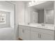 Spacious bathroom featuring a double sink vanity with modern lighting and fixtures at 4778 Moonstone Trce, Kennesaw, GA 30144