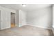 Large bedroom featuring neutral carpet, grey painted walls, and two doors at 4778 Moonstone Trce, Kennesaw, GA 30144