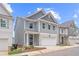Charming two-story home with gray siding, stone accents, and a two-car garage at 4778 Moonstone Trce, Kennesaw, GA 30144