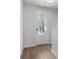 Bright foyer with hardwood floors and a view of the front door and exterior at 4778 Moonstone Trce, Kennesaw, GA 30144