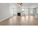 Open living room boasts lots of natural light and a fireplace with white shiplap at 4778 Moonstone Trce, Kennesaw, GA 30144