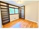 Cozy bedroom with hardwood floors, custom built-in bookshelves, and natural light, creating a quiet retreat at 813 Crockett Ct, Decatur, GA 30033