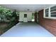 Spacious carport with access to the house and a storage area, providing convenience and protection from the elements at 813 Crockett Ct, Decatur, GA 30033