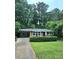 Charming brick ranch-style home with a well-manicured front yard at 813 Crockett Ct, Decatur, GA 30033