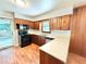 Practical kitchen with wood cabinets, newer appliances and convenient layout, offering an efficient cooking space at 813 Crockett Ct, Decatur, GA 30033