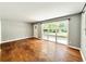 Open living room with hardwood floors and large windows offering plenty of natural light at 813 Crockett Ct, Decatur, GA 30033