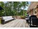 Spacious backyard deck with patio furniture and a grill, perfect for outdoor entertaining at 2163 Medfield Ne Trl, Chamblee, GA 30345