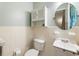 Classic bathroom with tiled walls, a vanity, and a round mirror at 2163 Medfield Ne Trl, Chamblee, GA 30345