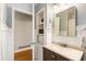 Bathroom with hardwood floors, white paneled walls, and new vanity at 2163 Medfield Ne Trl, Chamblee, GA 30345