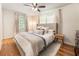 Cozy bedroom featuring hardwood floors, soft lighting, and neutral decor at 2163 Medfield Ne Trl, Chamblee, GA 30345