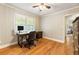 Bedroom featuring hardwood floors, a ceiling fan, a window, and a desk at 2163 Medfield Ne Trl, Chamblee, GA 30345