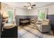 Charming Bedroom featuring a crib, comfortable glider, and playful decor at 2163 Medfield Ne Trl, Chamblee, GA 30345